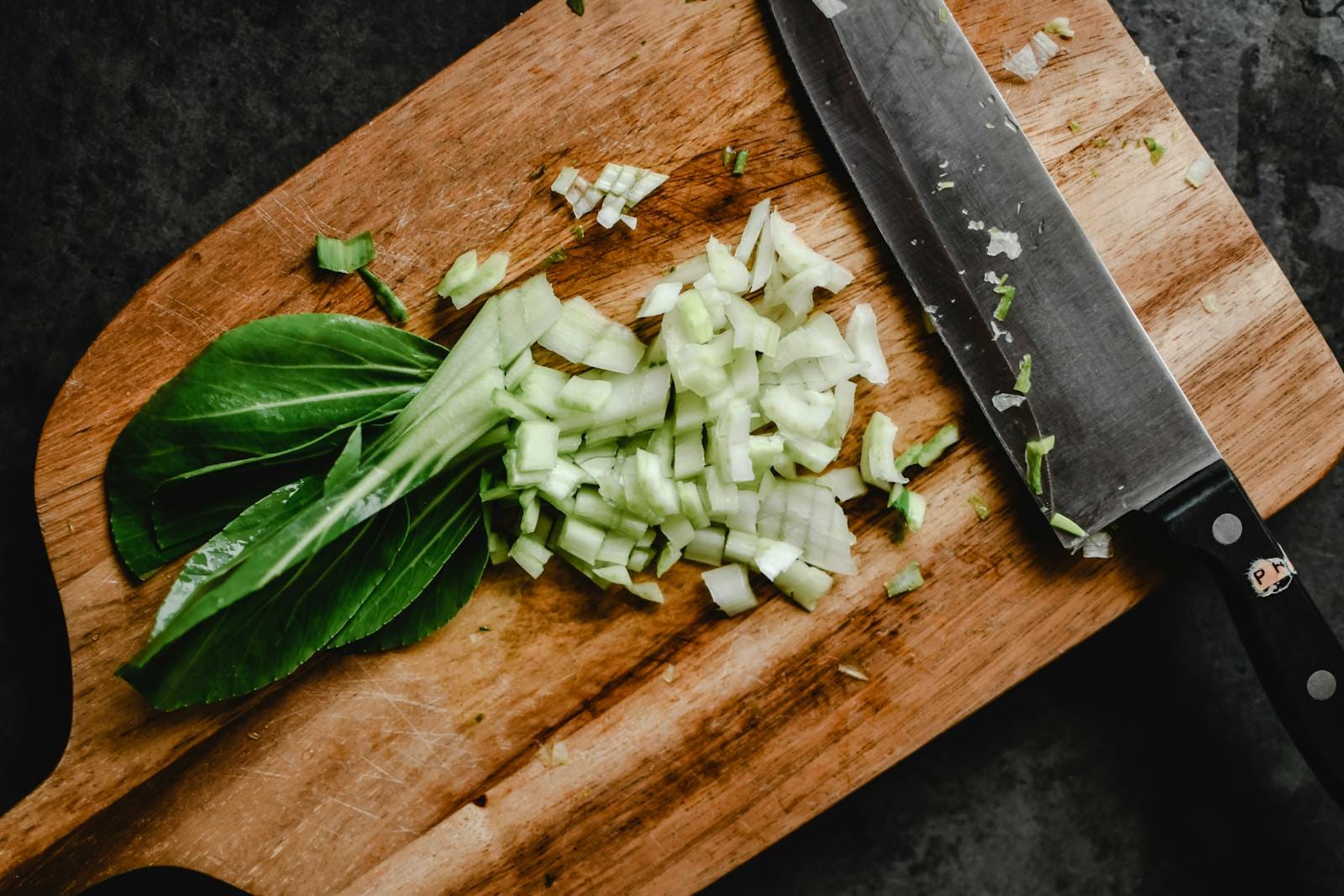 Slices of Cabbage on a Wooden Chopping Board